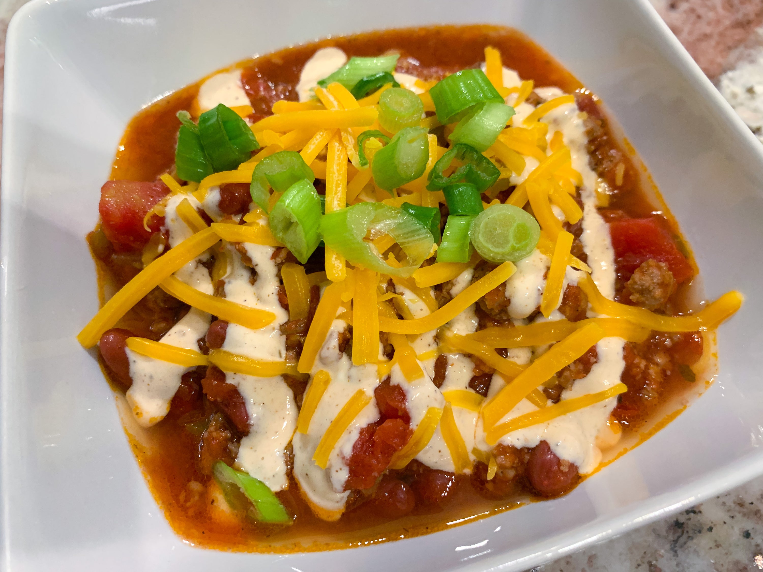 3 Meat Chili with Sour Cream Remoulade topping